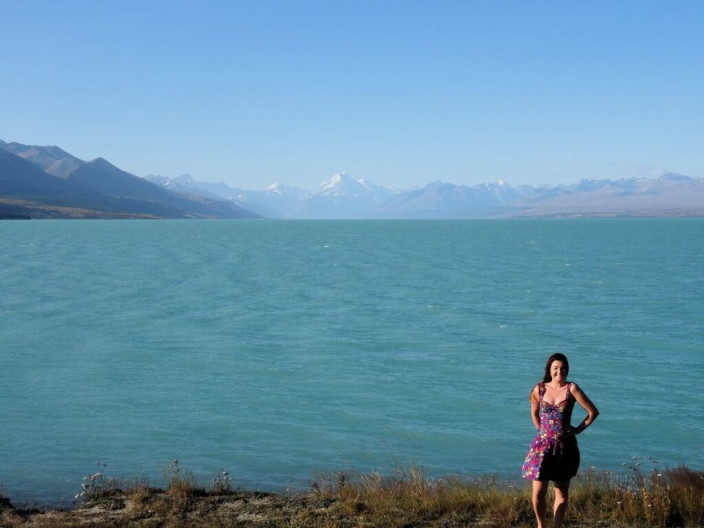 lady at lake pukaki windy day