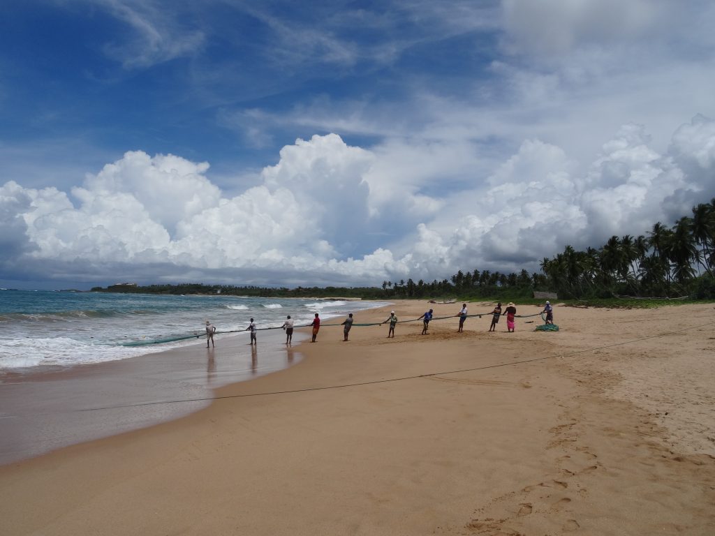 fishermen on rekawa beach