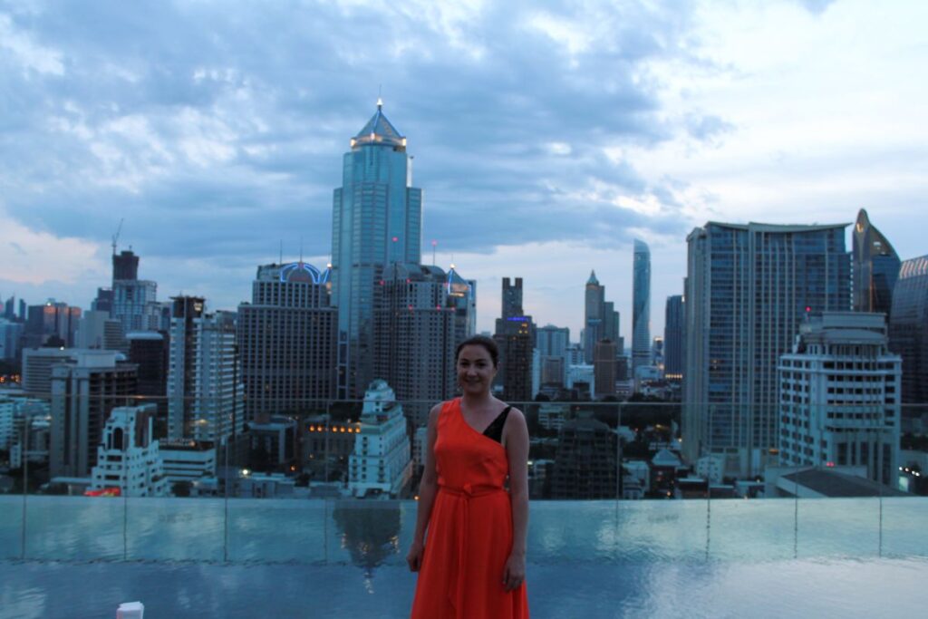 lady rooftop bangkok sunset