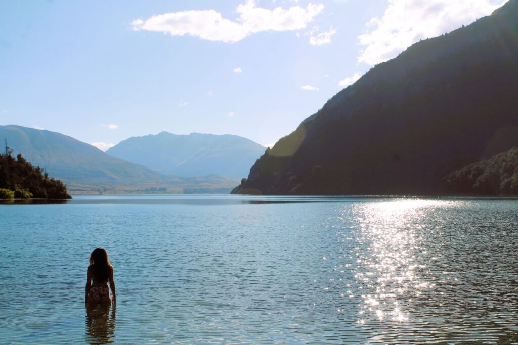 lady swimming lake te anau