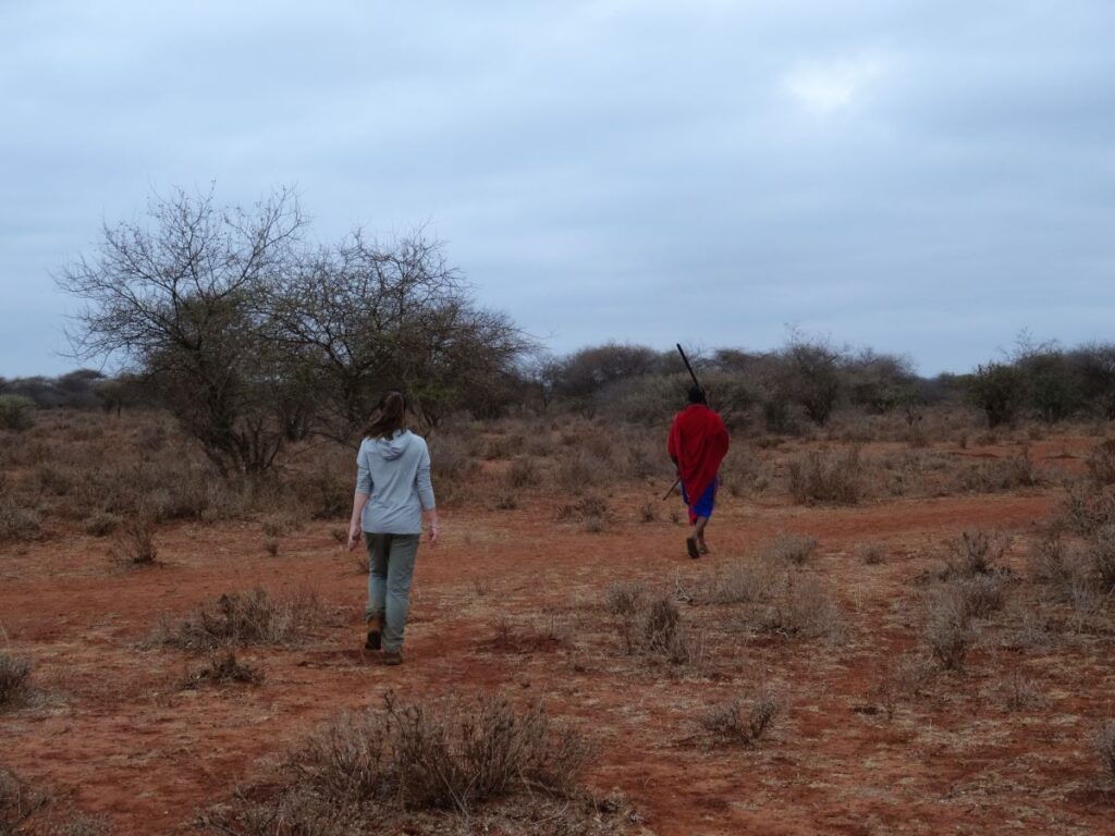 lady and maasai warrior on sunset safari