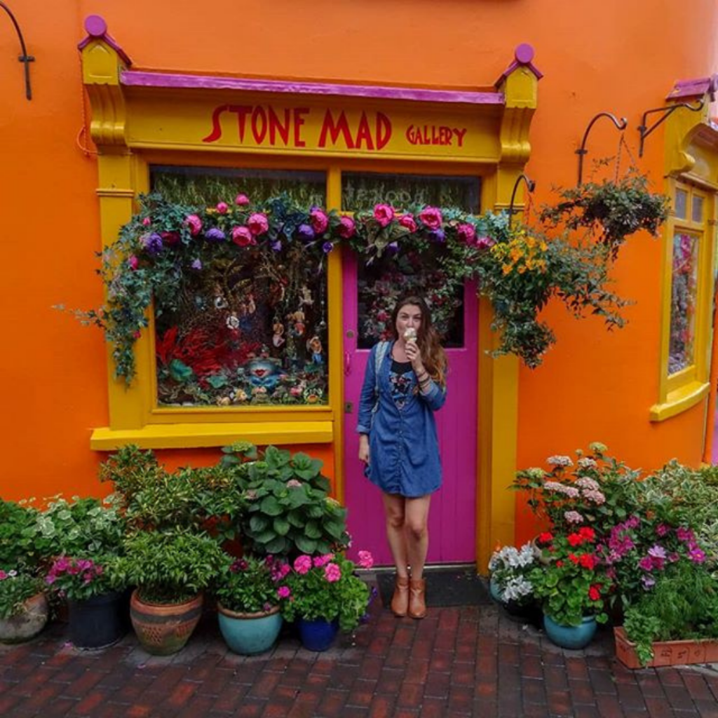 girl at colorful store front Kinsale Ireland