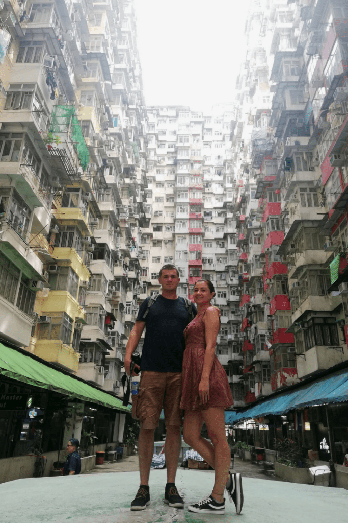 couple posing at monster building hong kong